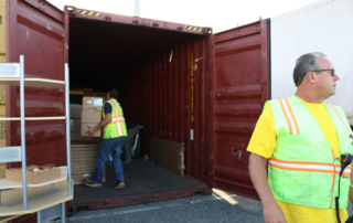 Port Employees Unloading Cargo