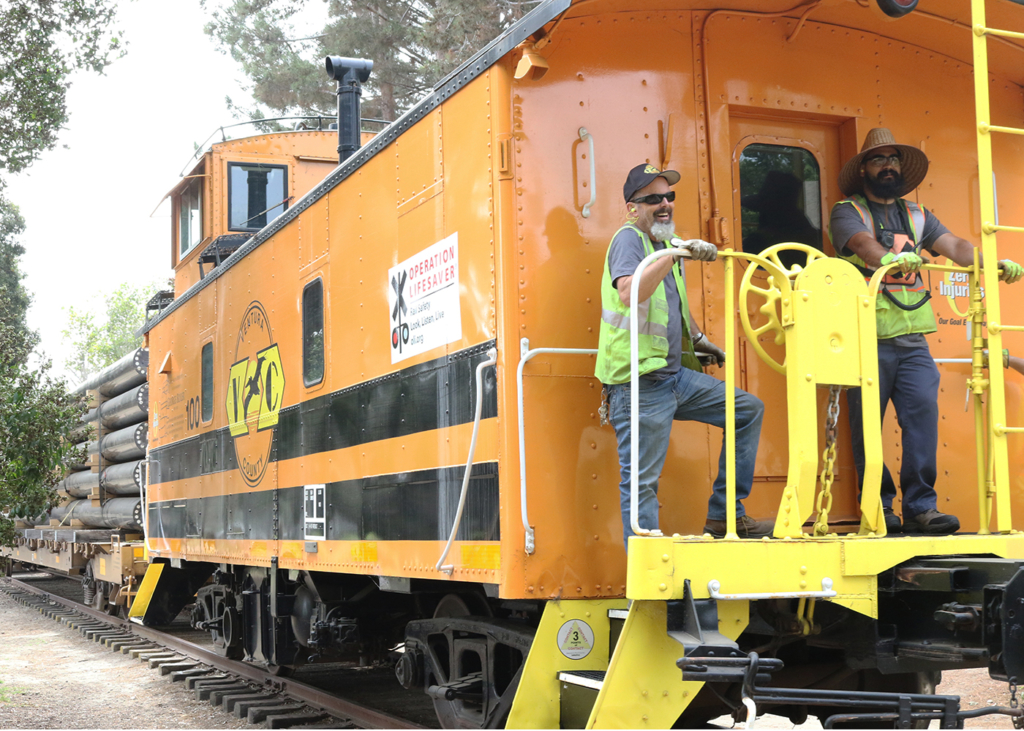 Train crew on the on the Genesee & Wyoming engine traveling to the final destination, the Port of Hueneme