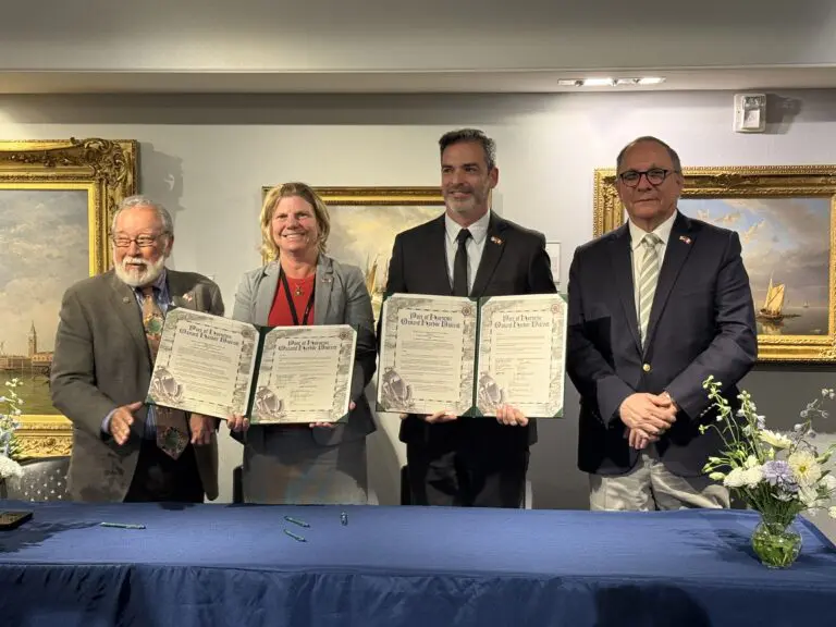 The ports’ CEOs and board members celebrate the MOU