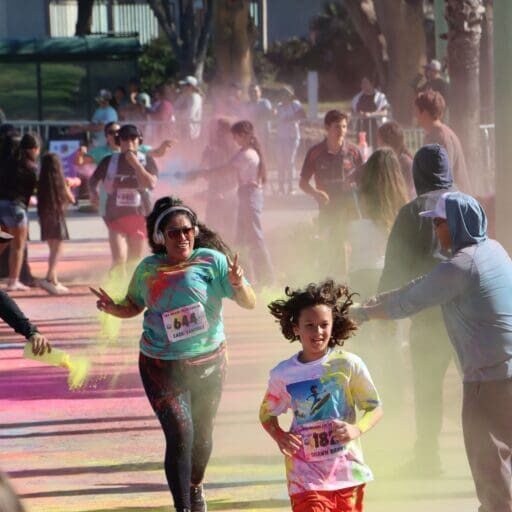 Runners pass through the color zone at the 2026 Sea Splash Color Dash