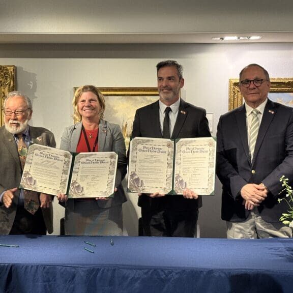 The ports’ CEOs and board members celebrate the MOU